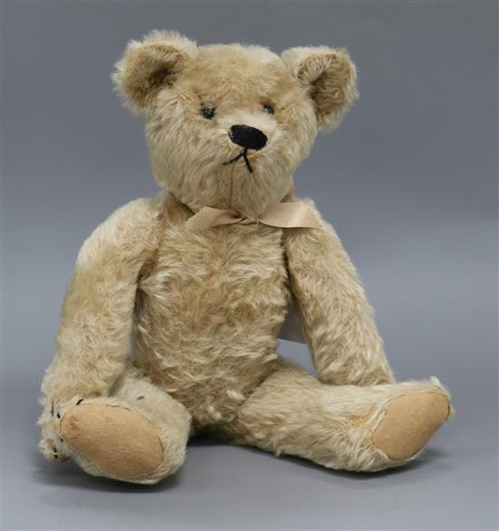 An American teddy bear, Jenny, c.1912, with pale blond mohair, black boot button eyes,